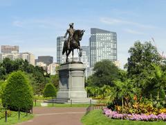 Statue of George Washington in Boston Public Garden with water and greenery
