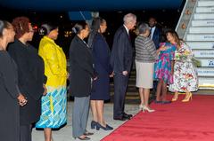 First Lady Melania Trump receiving flowers from Margaret Kenyatta at Jomo Kenyatta International Airport