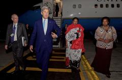 U.S. Secretary of State John Kerry walking with U.S. Ambassador to Kenya Robert Godec, Kenyan Foreign Affairs Cabinet Secretary Amina Mohamed, and Kenyan Deputy Chief of Protocol Monica Juma at Jomo Kenyatta International Airport Nairobi 2016