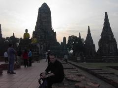 Ancient ruins of Ayutthaya with Adam Carr standing and admiring the site