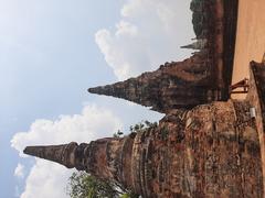 Stupa bell-shaped chedi and Buddha statues at Wat Chai Watthanaram temple in Ayutthaya, Thailand