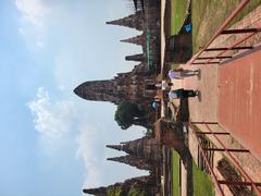 Grand prang central of Wat Chai Watthanaram temple surrounded by four smaller prangs and an enclosed gallery with eight stupa-shaped chapels