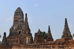 Temple Wat Chai Watthanaram with two Buddha statues and large prang in the background