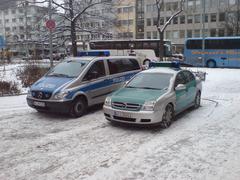 German police vehicles in blue and green livery parked in Frankfurt
