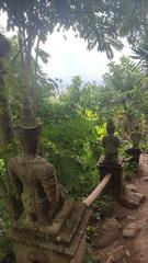 Shiva guards on Pilgrim monk trail in Chiang Mai Thailand viewed from behind