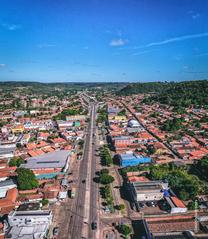 Aerial view of a city with urban buildings and natural surroundings