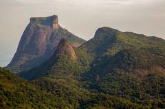 Scenic view of Pedra da Gávea mountain in Rio de Janeiro with forest and dramatic sky