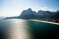Scenic view of Pedra da Gavea mountain in Rio de Janeiro with lush greenery and cloudy sky