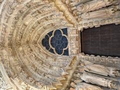 Detailed view of the portico of Notre-Dame Cathedral in Reims, showcasing intricate Gothic architecture and sculptures
