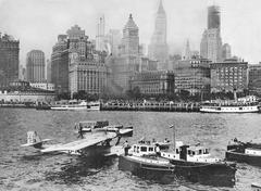 Dornier Wal seaplane D-1422 of Deutsche Verkehrsfliegerschule after transatlantic flight landing in New York Harbor with Lower Manhattan skyline