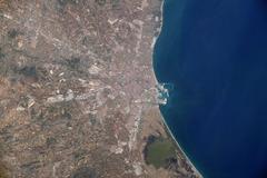 Aerial view of Valencia, Spain from the International Space Station showing city and coastline near the Mediterranean Sea