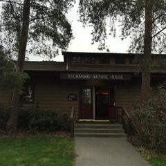 Richmond Nature Park Nature House surrounded by lush greenery in Vancouver, Canada