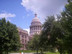 Texas State Capitol building viewed from a unique perspective with blue sky background