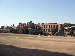 Ancient Roman ruins with columns and historical buildings under clear blue sky in Rome, Italy