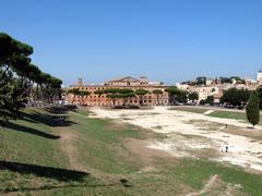 Aerial photo of the Circus Maximus in Rome showing ancient ruins and surrounding greenery