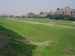 Aerial view of the ancient Roman Circus Maximus surrounded by modern buildings in Rome