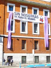 Paseo del Prado street in Madrid with historic buildings and statues