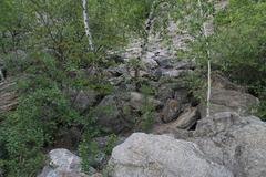 Růženin lom quarry landscape with rock formations and greenery