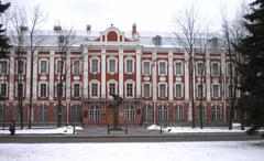 Main entrance of the university with 12 collegiums building and Genius Student monument