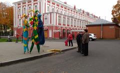 Group of participants at a wiki conference interacting with street performers at Sakharov Square in Saint Petersburg