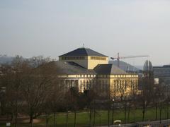 Staatstheater Saarbrücken building exterior with illuminated architectural details at dusk