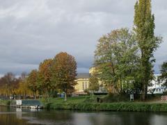 Beautiful autumn foliage along the Saar River in Saarbrücken with reflections in the water