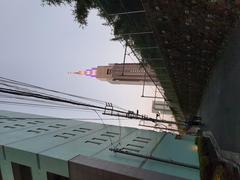 Docomo Tower viewed from a small street alongside the Yamanote line in Tokyo
