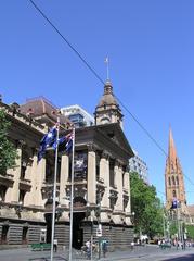 Melbourne City Town Hall building with clock tower and flagpole