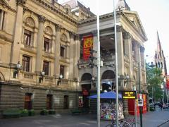 Melbourne Town Hall in morning light during April with banners for Melbourne International Comedy Festival