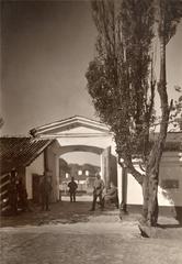 Historical black and white photograph of Vilnia, showing Rosy alley and the notable monastery landmark.