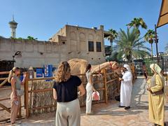 Traditional architecture in Al Bastakiya, Dubai with beige buildings and wooden lattice windows under a clear blue sky