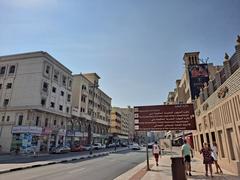 Traditional architecture of Al Bastakiya district in Dubai with beige wind towers and narrow alleys
