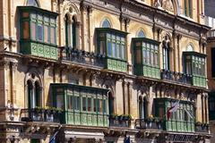 Balconies in Valletta with traditional Maltese wooden enclosed balconies and colorful shutters