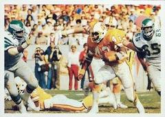 1986 Jeno's Pizza NFL football card of Ricky Bell running back for Tampa Bay Buccaneers rushing ball in 1979 NFC Divisional Playoff Game