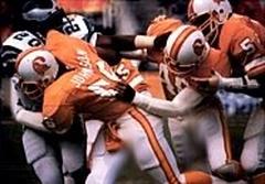 1986 Jeno's Pizza NFL football card showing Tampa Bay Buccaneers linebacker Cecil Johnson tackling Philadelphia Eagles running back Leroy Harris in 1979 NFC Divisional Playoff Game
