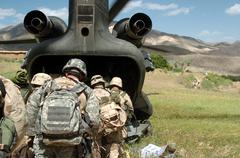Soldiers from the 173rd Airborne Brigade boarding a CH-47 Chinook Helicopter during a mission in Shah Wali Ko, Afghanistan, June 22, 2005