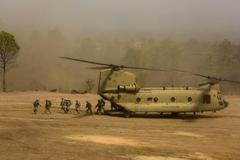 U.S. Army CH-47 Chinook helicopter transporting soldiers during combined arms live fire exercise in Thailand
