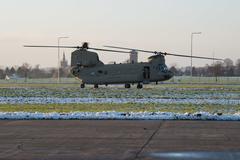 U.S. Army crew member exiting CH-47 Chinook helicopter on Chièvres Air Base