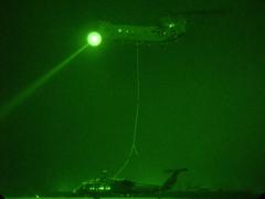 CH-47 Chinook helicopter sling loading UH-60 Black Hawk helicopter for airlift at Camp Taji Iraq