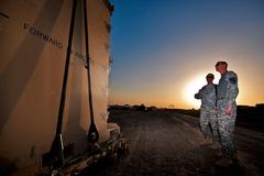 Chief Warrant Officer 2 Stephen Wells and 1st Lt. Michael Siddall discussing safety during CH-47F Chinook sling load training