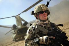 U.S. Army Staff Sgt. James Bates providing security at a landing zone during a CH-47 Chinook helicopter disembarking in Farah province Afghanistan