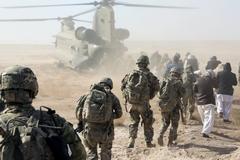 U.S. Soldiers and Sailors with Farah Provincial Reconstruction Team boarding CH-47 Chinook helicopter in Lash-e Juwayn Afghanistan January 2013