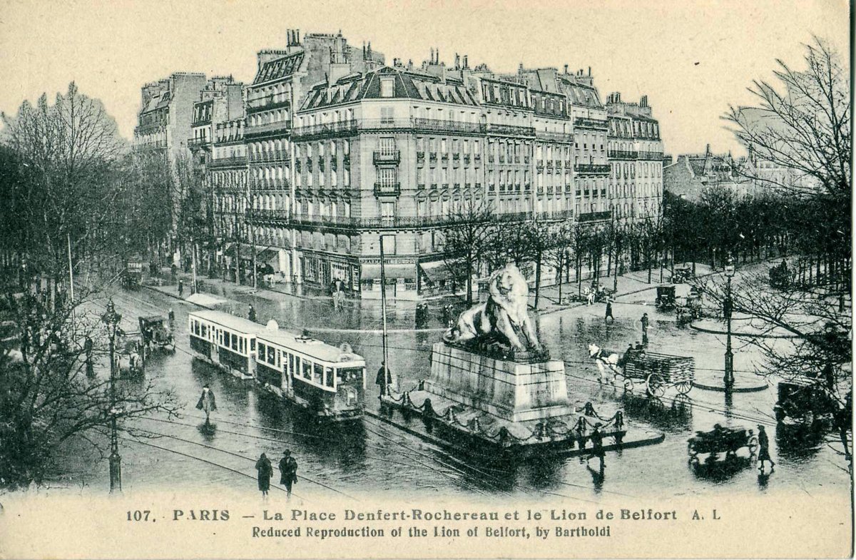 Old postcard of Place Denfert-Rochereau in Paris showing the Lion of Belfort statue and vintage tramway
