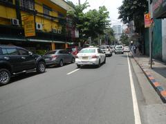 Busy intersection at M. H. del Pilar Street and United Nations Avenue with Carlos P. Romulo Monument in Ermita, Manila