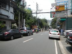 Street view of M. H. del Pilar Street in Ermita, Manila with United Nations Avenue and Roxas Boulevard intersection featuring Carlos P. Romulo Monument