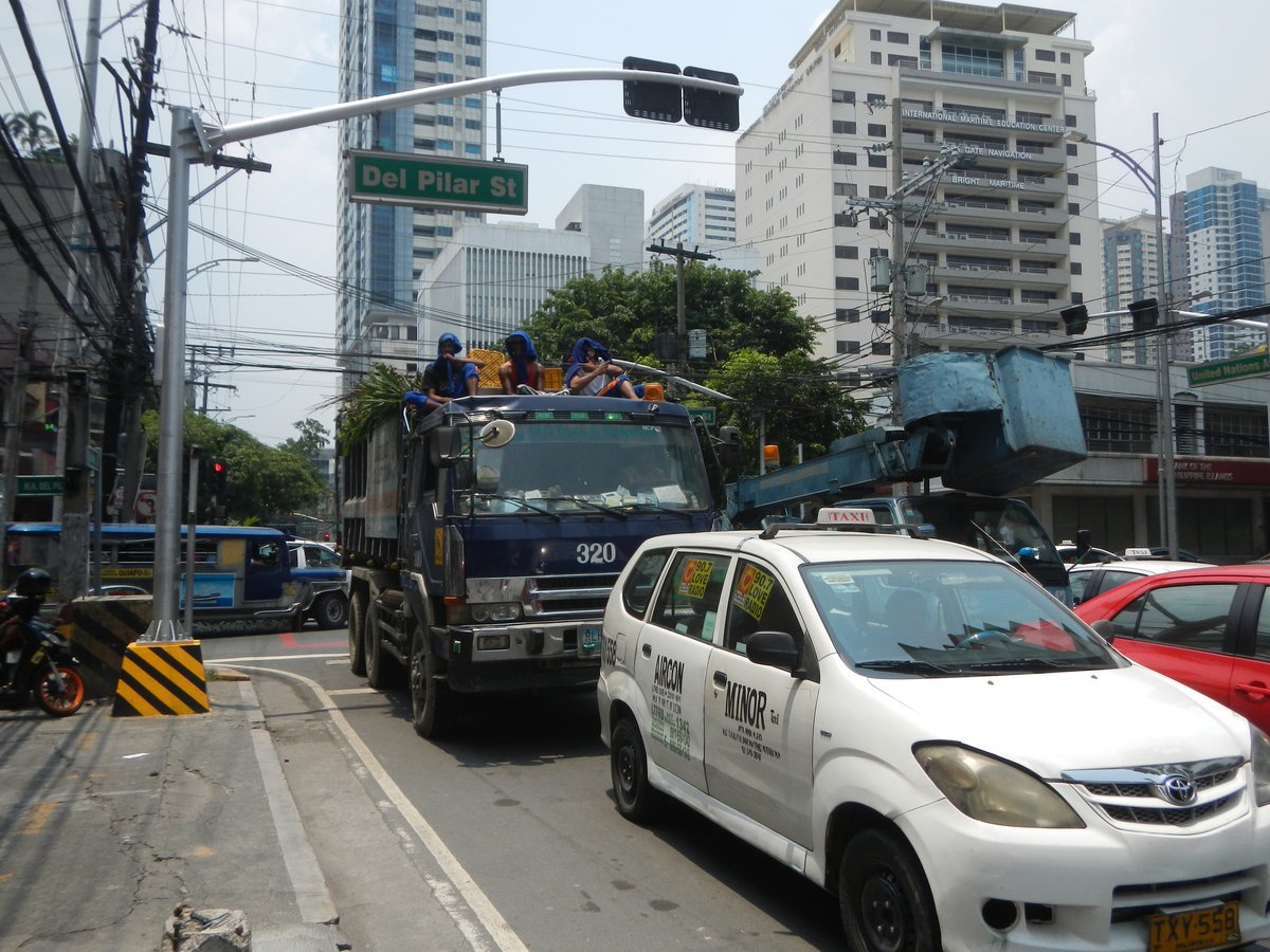 Carlos P. Romulo Monument at the corner of Roxas Boulevard and United Nations Avenue in Ermita, Manila with surrounding streets and buildings