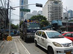 Carlos P. Romulo Monument at the corner of Roxas Boulevard and United Nations Avenue in Ermita, Manila with surrounding streets and buildings