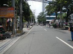 Street view of M. H. del Pilar Street at the corner of United Nations Avenue and Roxas Boulevard in Ermita, Manila showing Carlos P. Romulo Monument and nearby urban roads