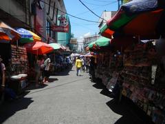 Street corner of A. Bautista Street and Hidalgo Street in Quiapo, Manila with urban buildings and vehicles