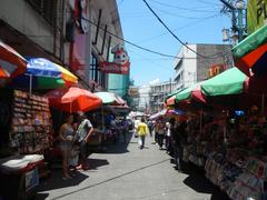 Street corner of A. Bautista Street and Hidalgo Street in Quiapo, Manila with visible buildings, vehicles, and street signs